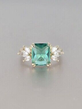 Gold Ring with Emerald Green Square Center and Clear Accent Stones
